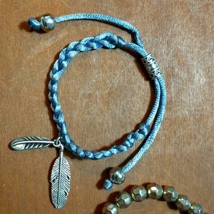 2 bracelets - 1 adjustable braid and 1 elastic.